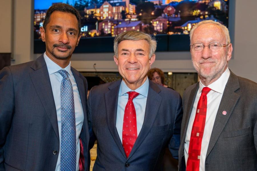 Three people wearing suits