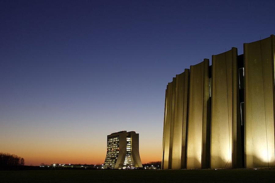 Modern building, illuminated windows a sunset