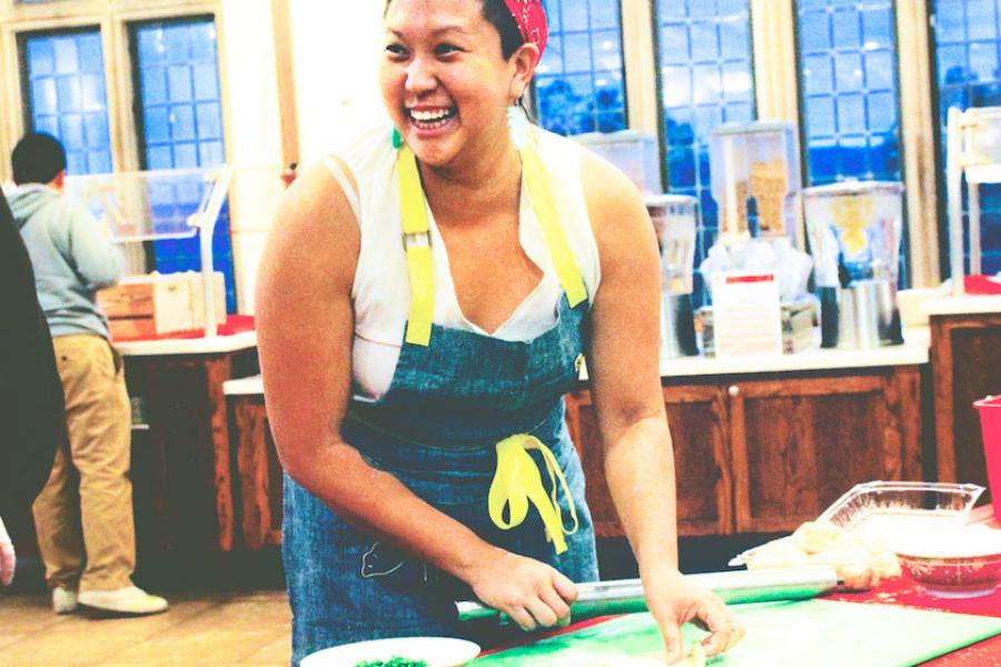 Person cooking in a dining hall