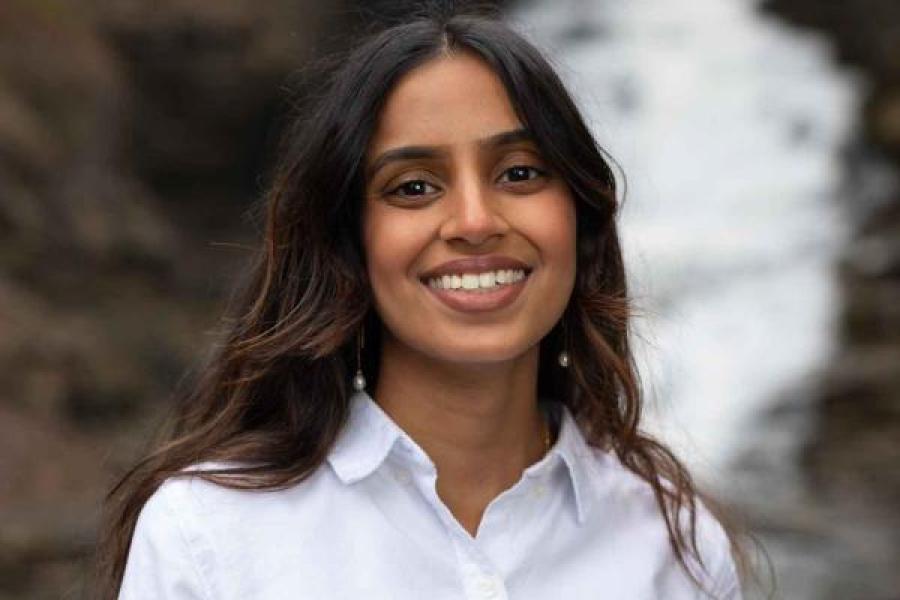 woman in front of waterfall