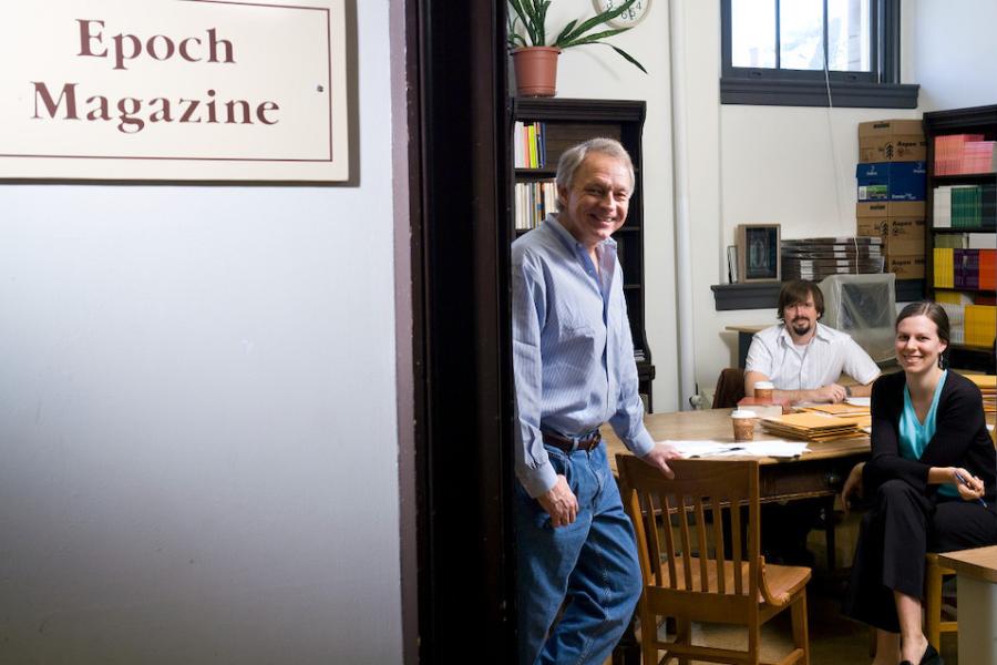 Person staning inside a room with a book shelf