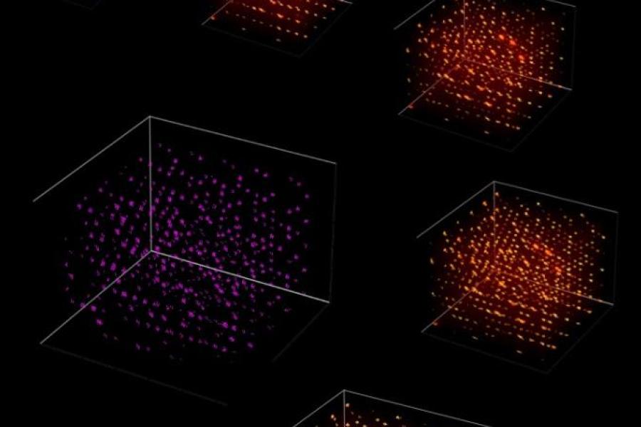 Five clusters of bright orange light surrounding one cluster of dimmer magenta light