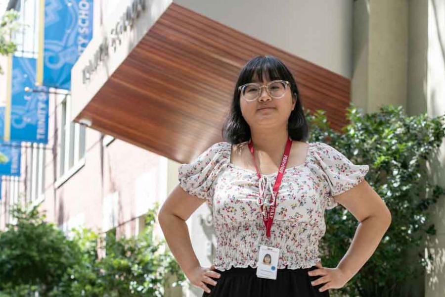 woman standing in front of school