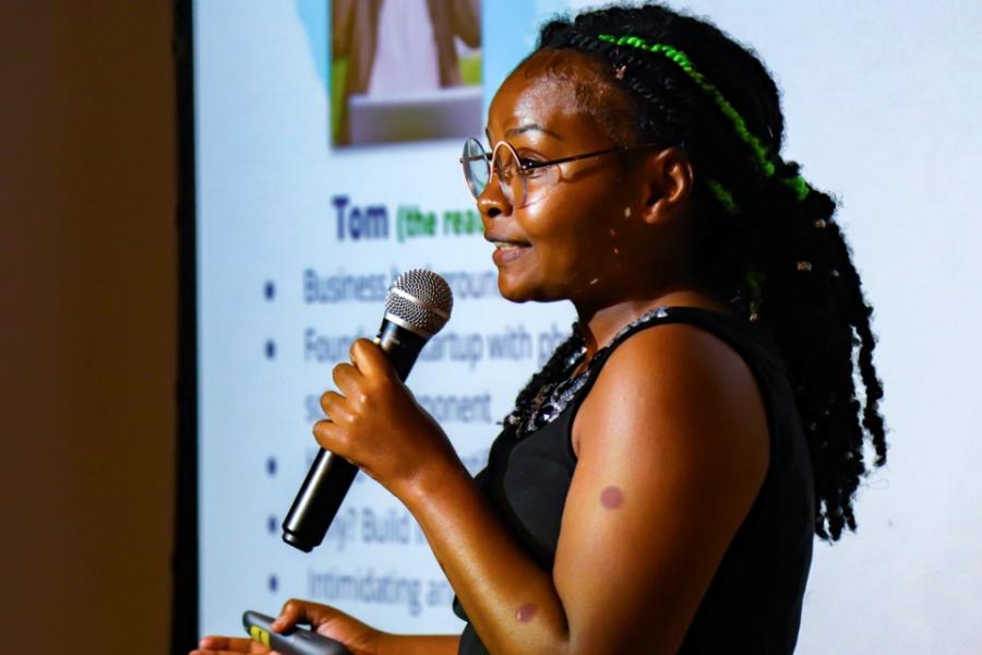 Person speaking into a microphone