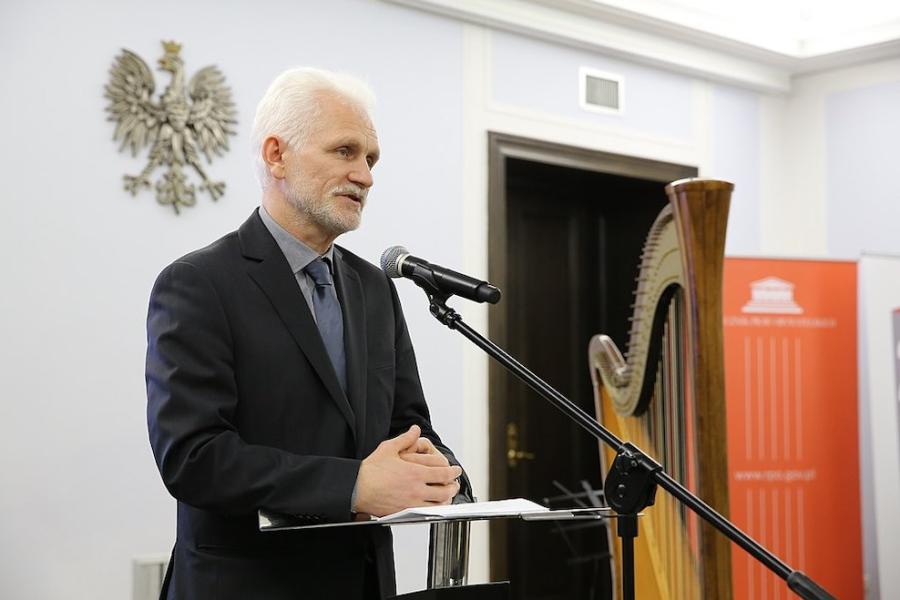 Person speaking in front of a microphone