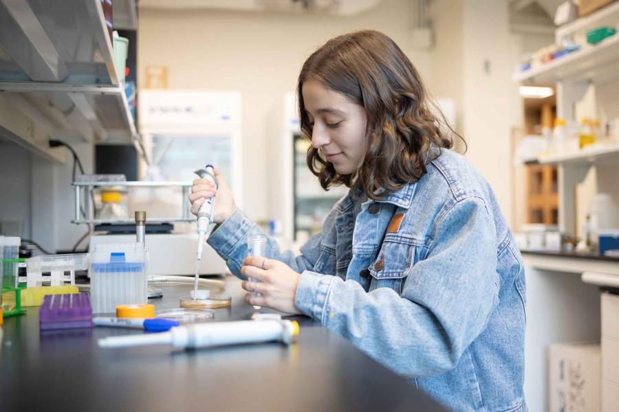 woman with test tubes and pipette
