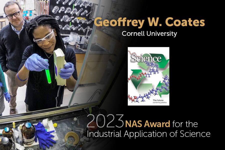 Three people handle chemistry equipment in a lab