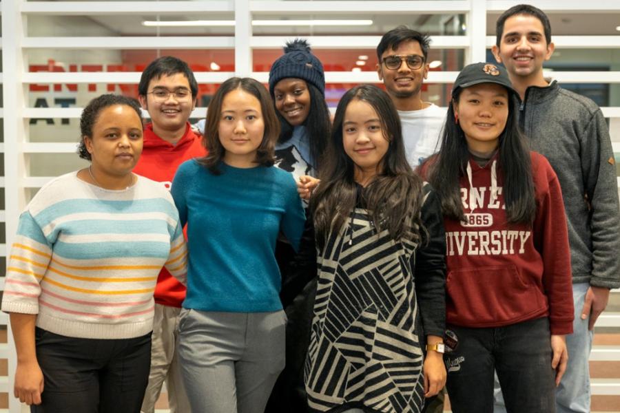 Eight students face forward