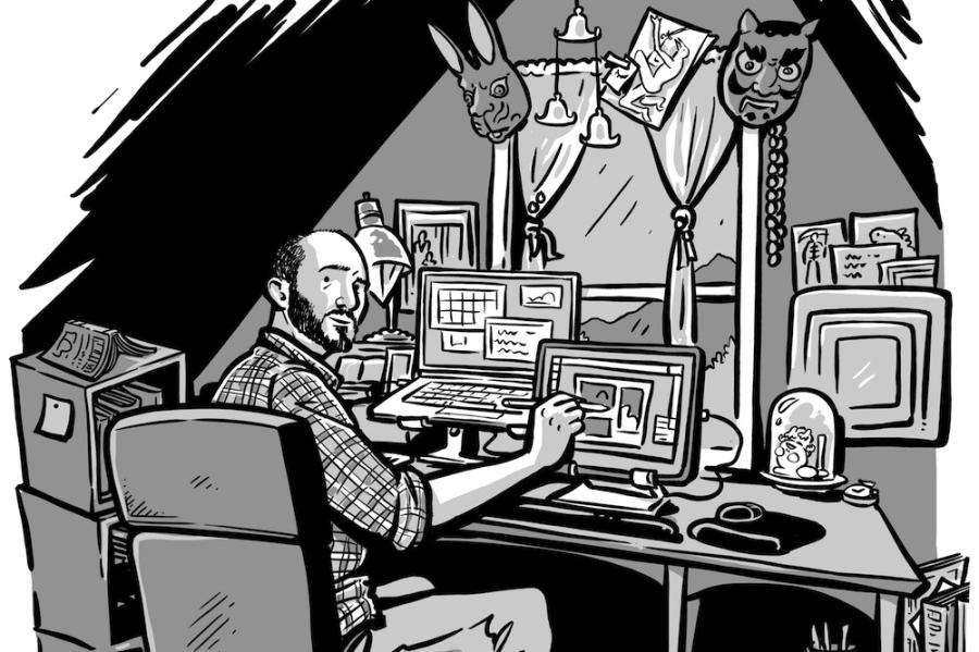 Black and white comic image of a person sitting at a desk, drawing