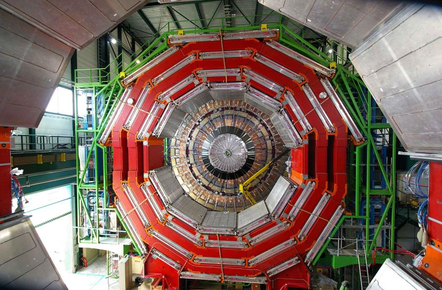 Alternating layers in a huge instrument with a center circles within circles surrounded by scaffolding.