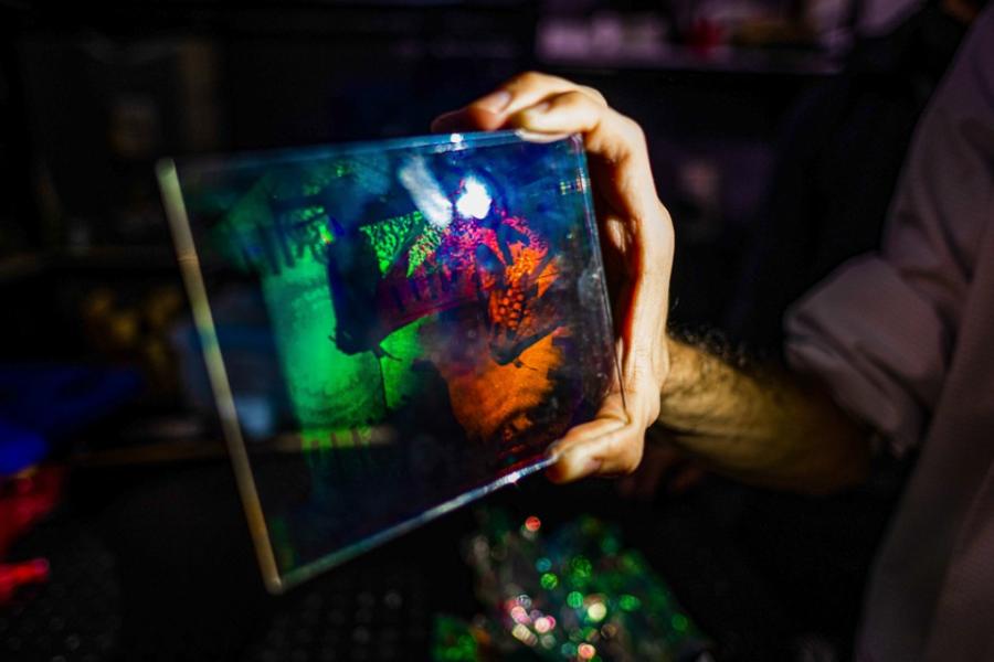 Hand holding a colorful rectangle