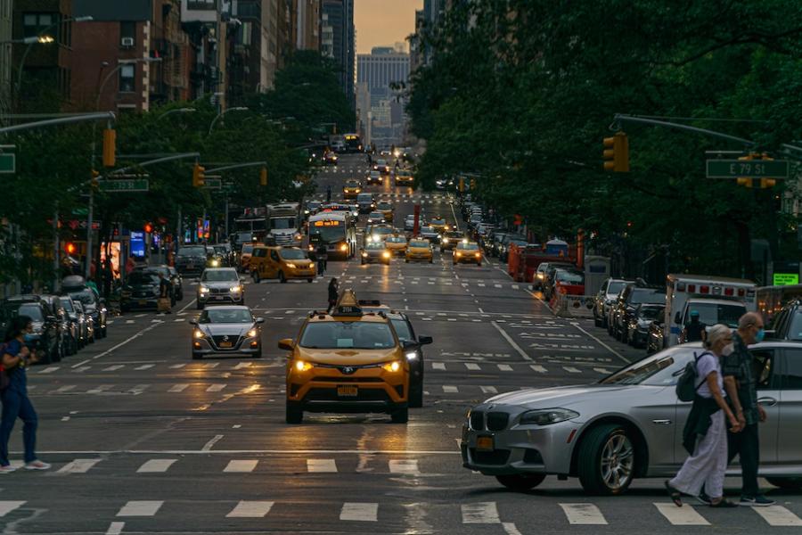 A wide city street at night