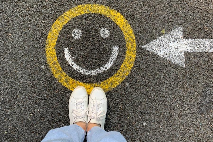 Happy face drawn on pavement