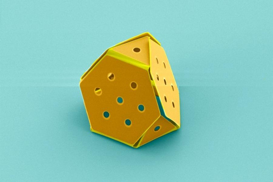 Yellow paper with six sides and six holes on each side folded together into a shape