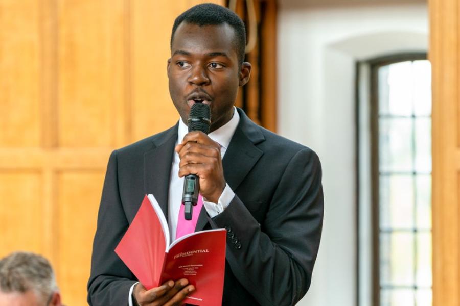 person speaks into a microphone