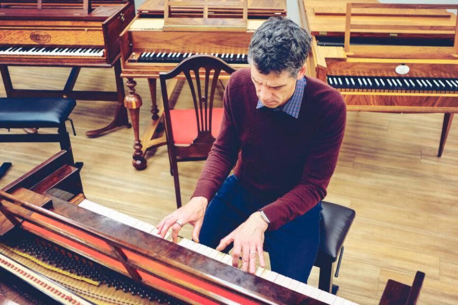 Person playing a keyboard instrument, seen from above