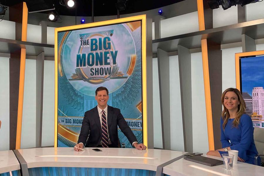 three people on a TV set