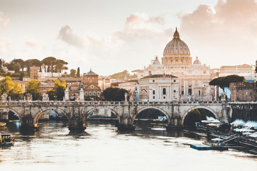 Rome at sunrise: Cathedral dome in the distance, bridge in the foreground