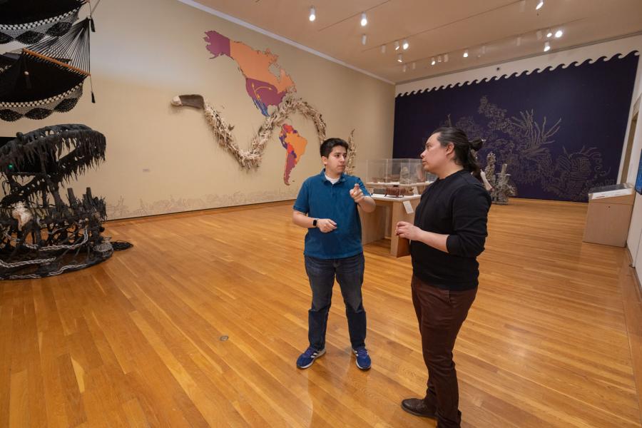 two people standing in a museum exhibit