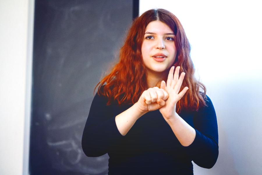Person making a sign using both hands