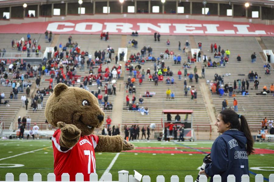 person with Touchdown the bear