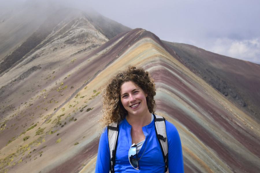 person in front of mountain