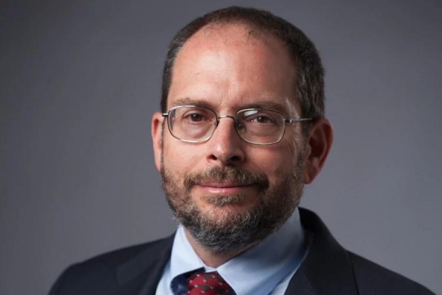 Jonathan Lunine, with glasses, beard and mustache, and suit and tie