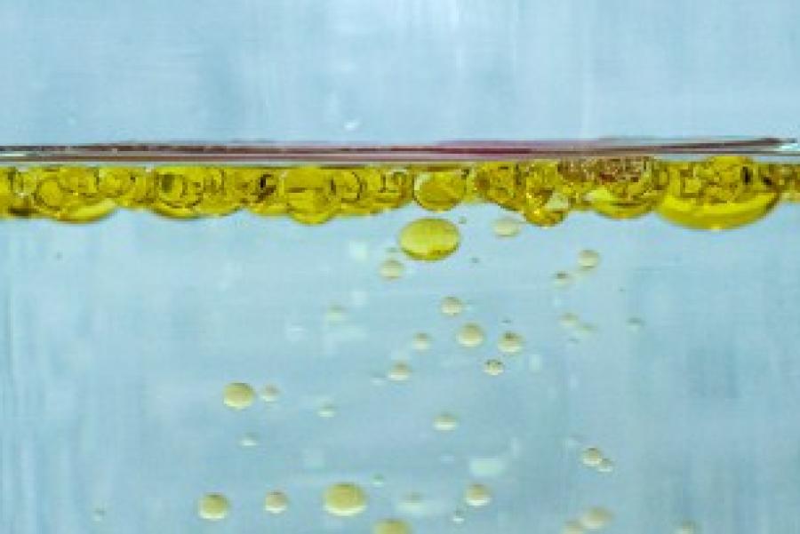 Blue background with a line of gold bubbles 3/4 of the way up