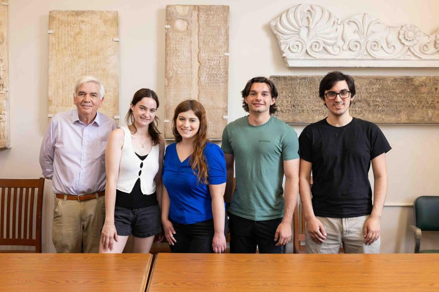 five people in front of Medieval plaster casts