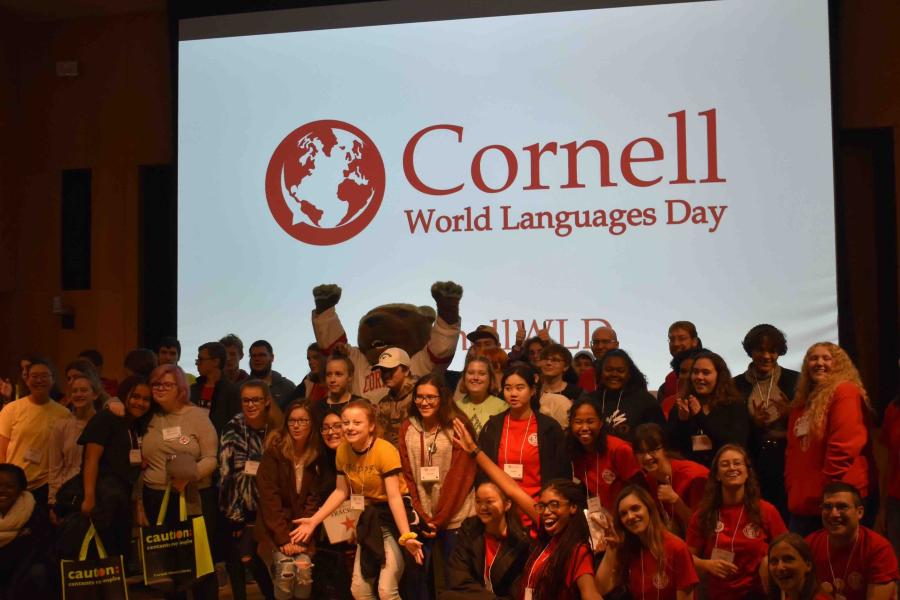 Students in front of Screen that says Cornell World Languages Day