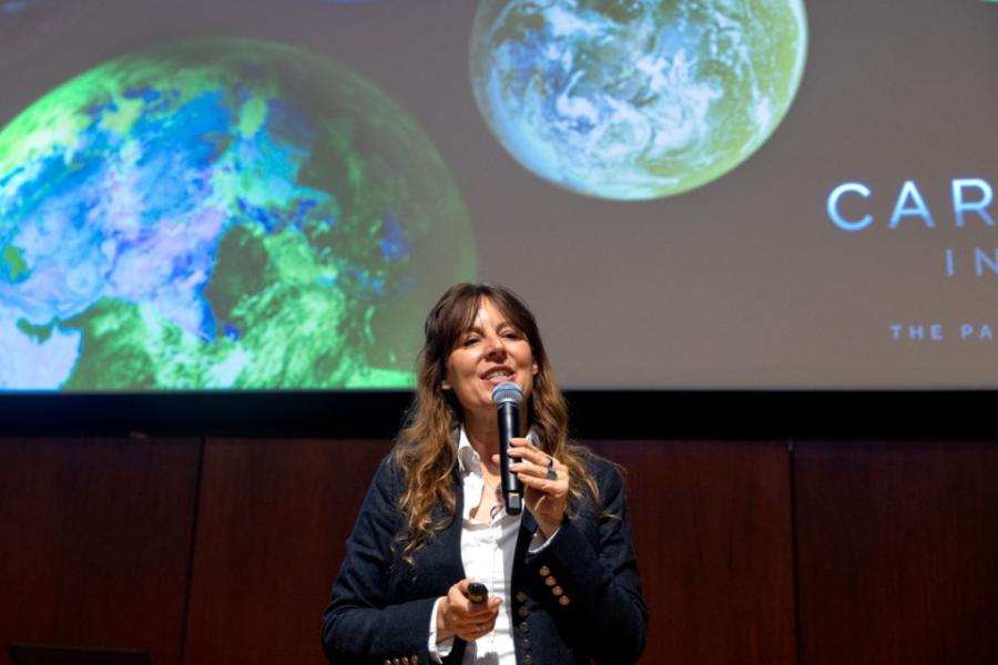 Person speaking into a microphone 