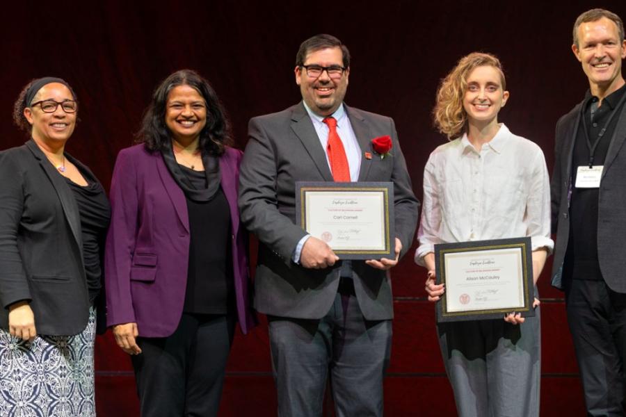 Five people hold awards