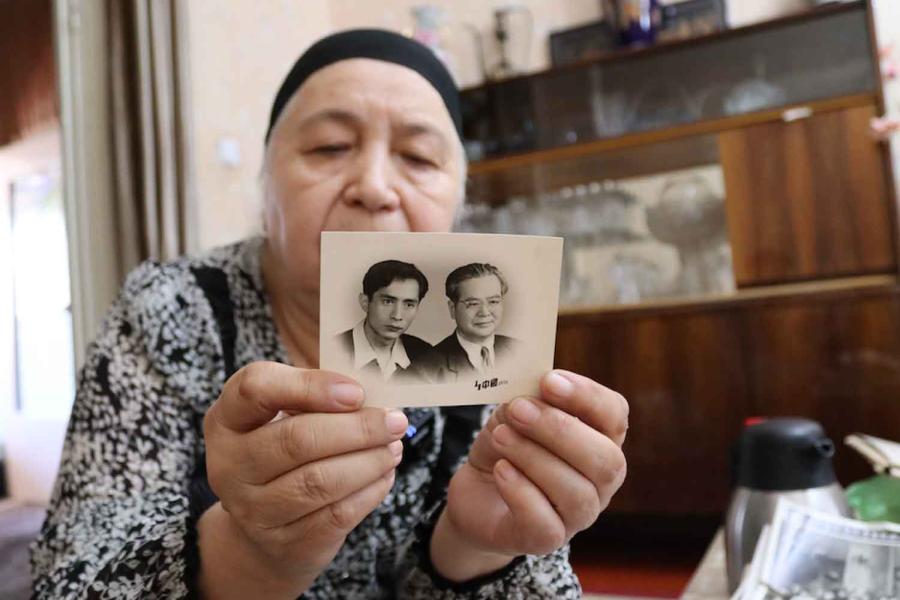 woman holding a photo