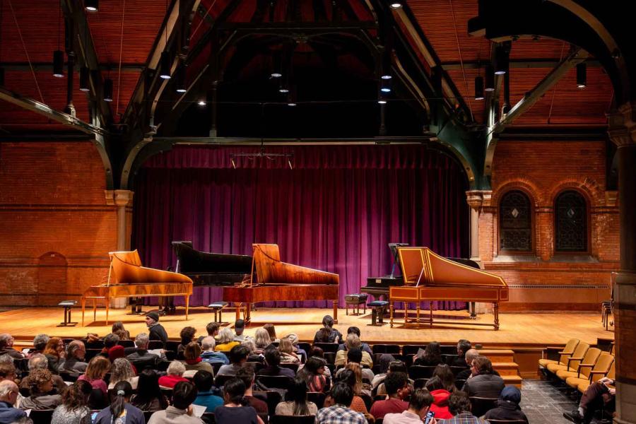 three pianos on a stage