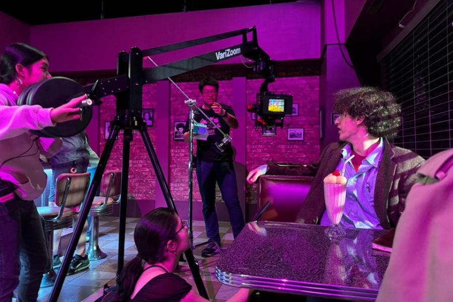 People on the dimly-lit set of a film