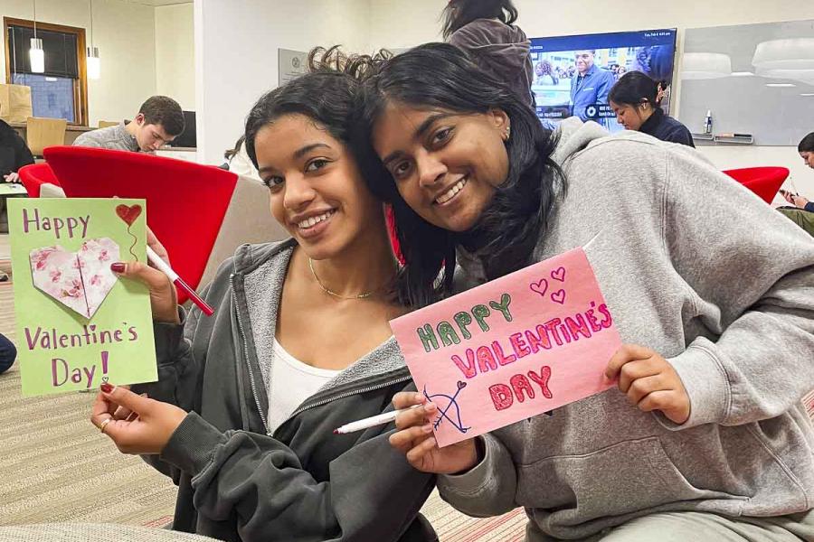 two people holding cards