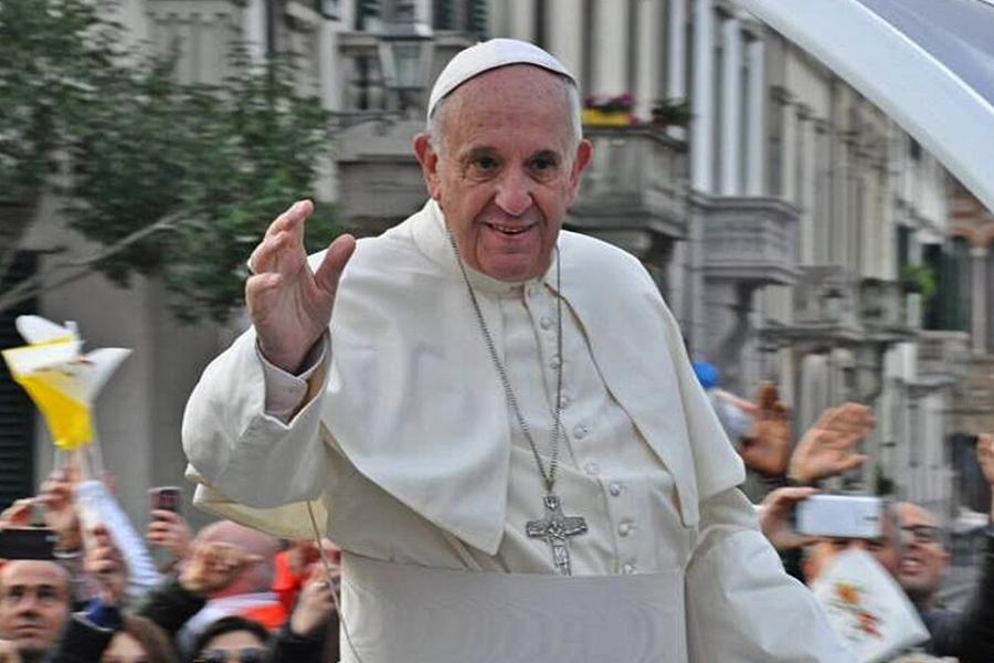Pope Francis waves to a crowd