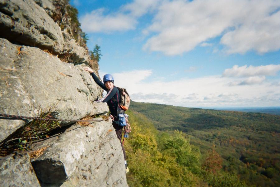 person rock climbing