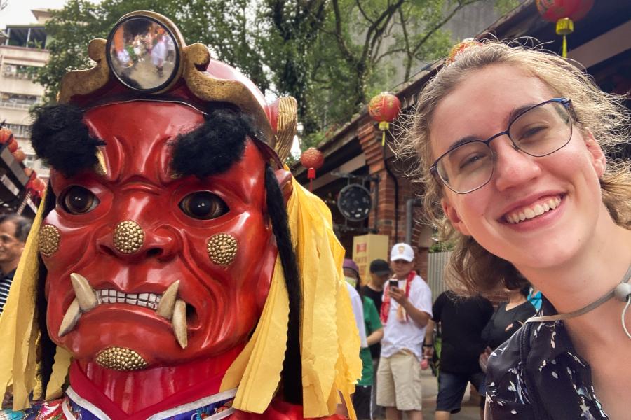 person standing beside someone wearing a mask
