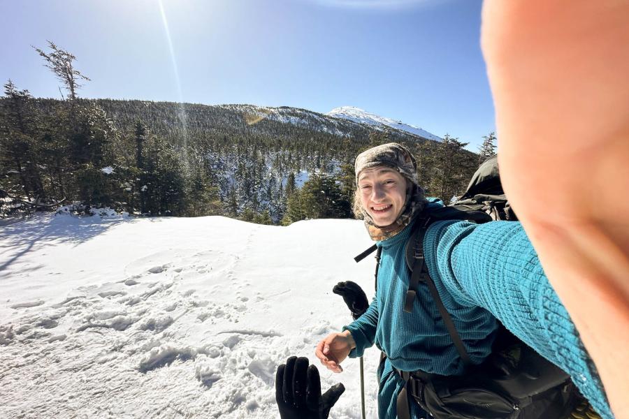 person hiking in snow