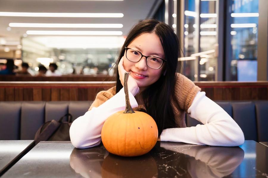 person with pumpkin
