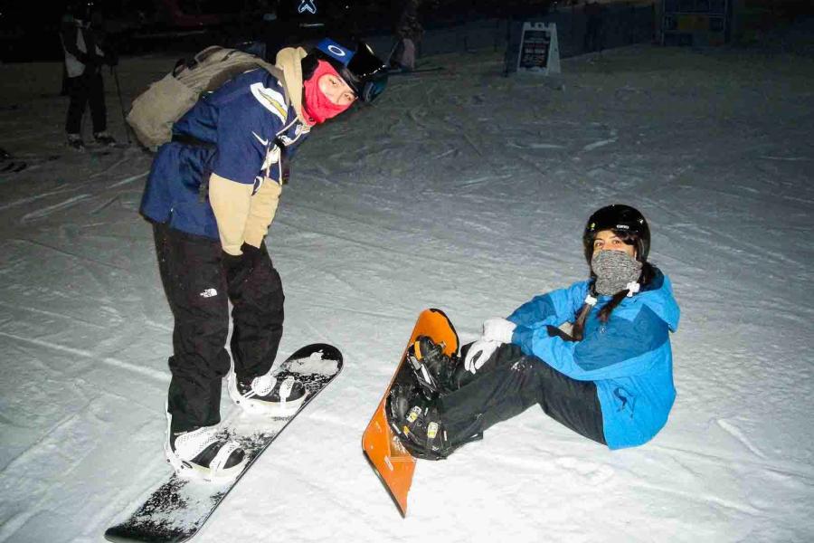 two people on snowboards