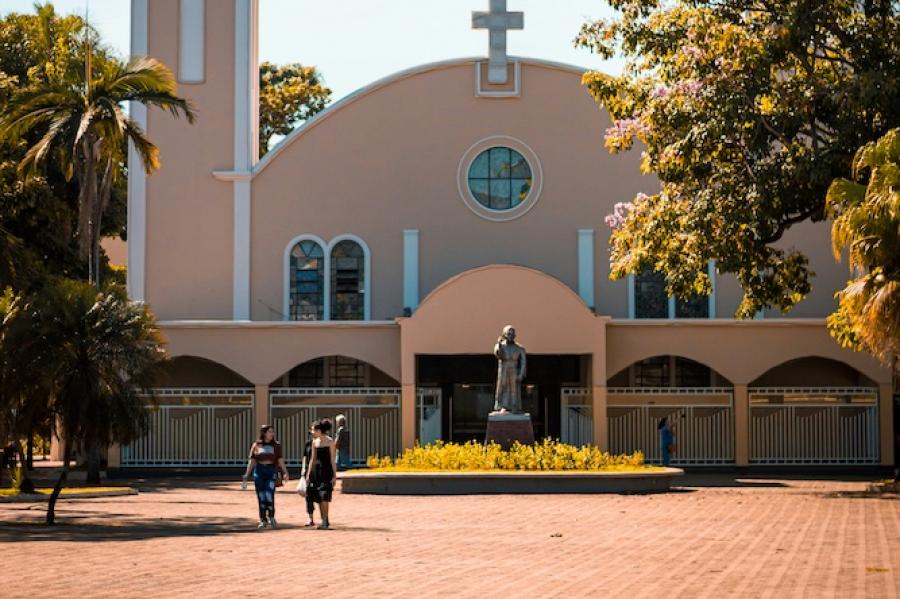 Building with a cross on top, blue ksy