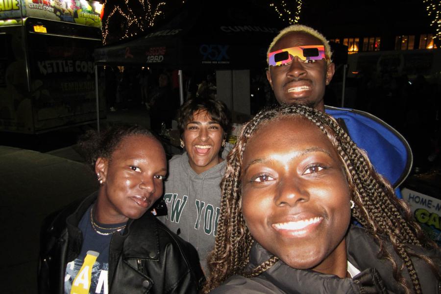 people outside in the dark