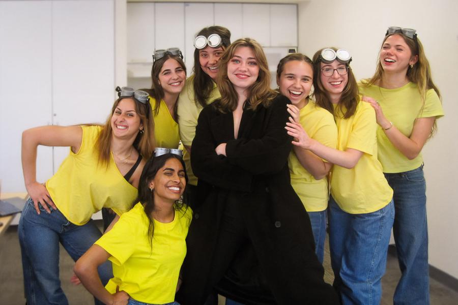 a group of people in yellow shirts