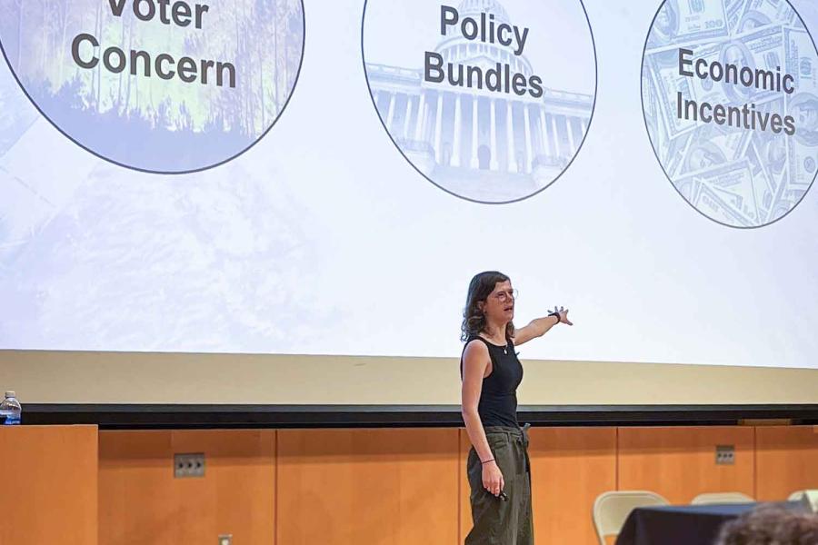 person pointing at a screen