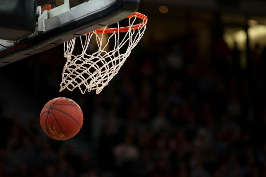 Basketball going through a net
