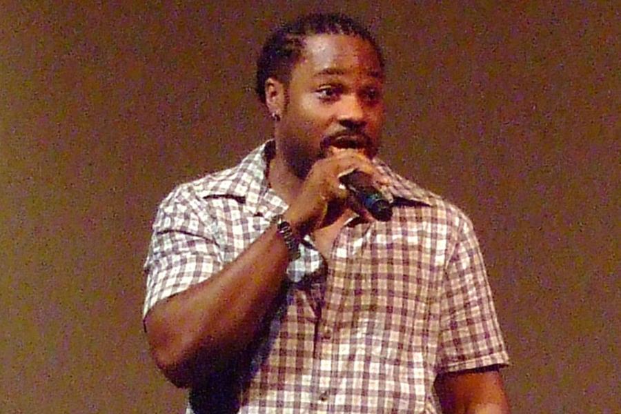 Person speaking into a microphone