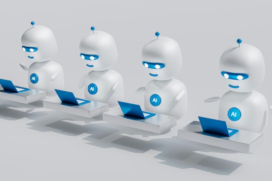Cartoon illustraiton of four little white robots looking at little blue laptop computers