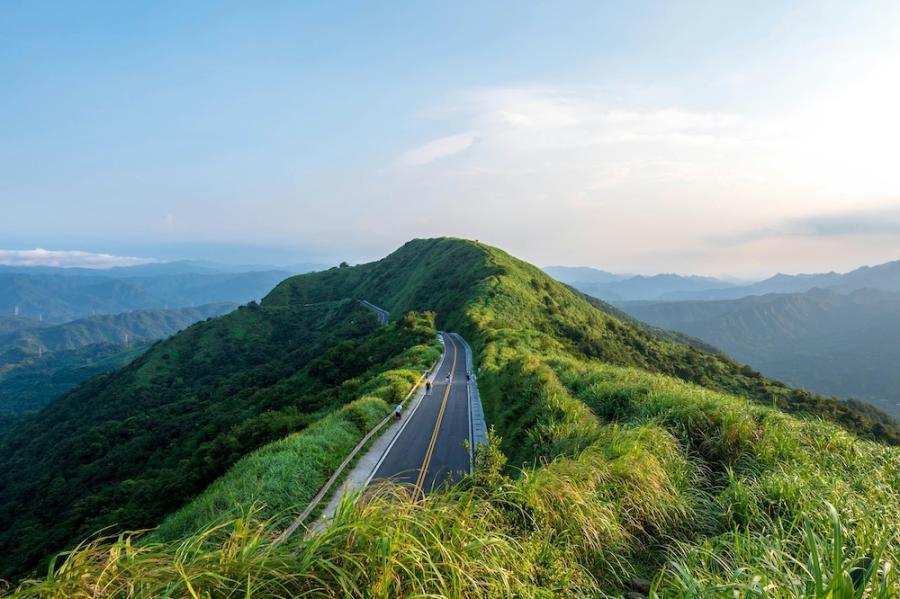 Grassy hill with a road leading up it: Scene from Taiwan